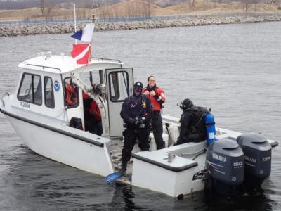 divers on a boat preparing to enter water