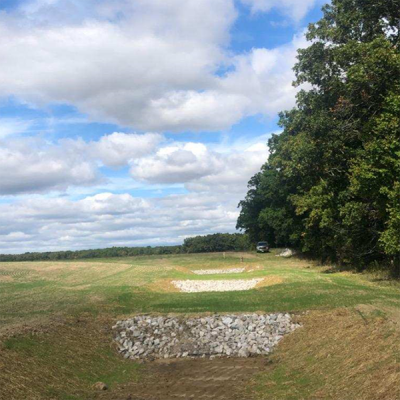 a ditchlike runoff management structure