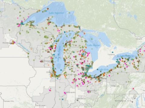 Map displaying the Great Lakes region, including Lake Superior, Lake Michigan, Lake Huron, Lake Erie, and Lake Ontario. The map is marked with various colored dots representing different data points or locations of GLRI projects per Focus Area around the lakes and surrounding areas. The dots are scattered across the map, indicating a wide distribution of data points throughout the region.