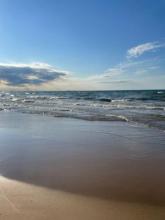 Shores of Lake Michigan from Miller Beach, Indiana. On the horizon is an outline of the City of Chicago. 